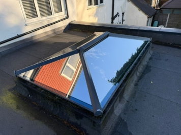 Residential roof lantern skylight fitted with reflective solar control window film, reducing heat gain and glare while maintaining natural daylight inside the property