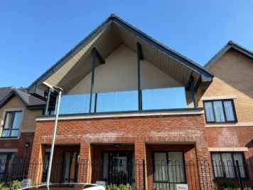 Residential balcony glazing fitted with solar control window film, providing enhanced privacy, glare reduction and heat control for modern apartment living