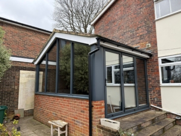 Residential home extension with large glazed panels fitted with solar control window film, reducing heat and glare while maintaining natural light.