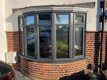 Residential bay window fitted with solar control window film to reduce glare and heat, installed by TS Window Films for improved comfort and privacy